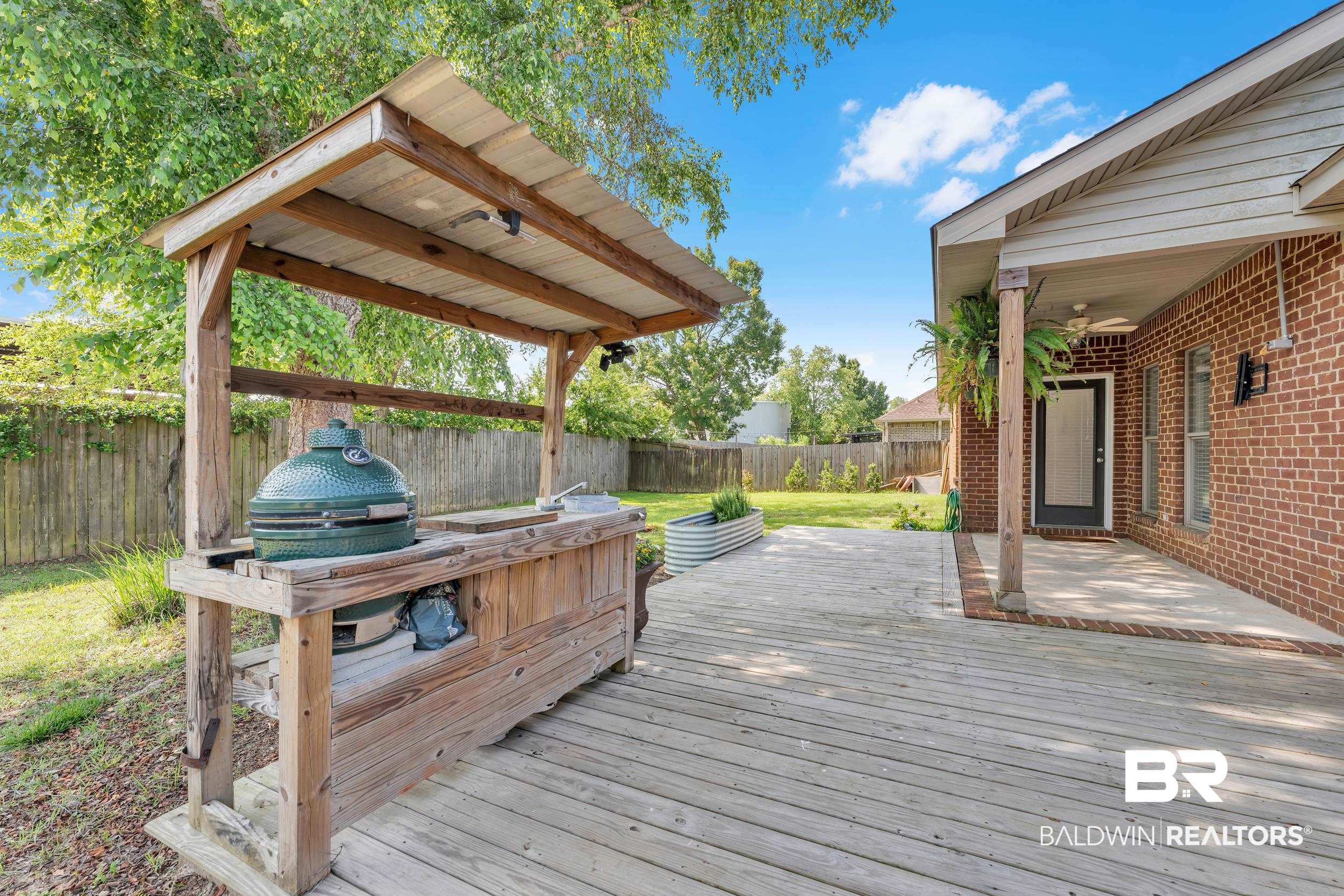 9508 Collier Loop Daphne, AL 36526 - Photo 9 of 29 Wooden deck featuring a fenced backyard