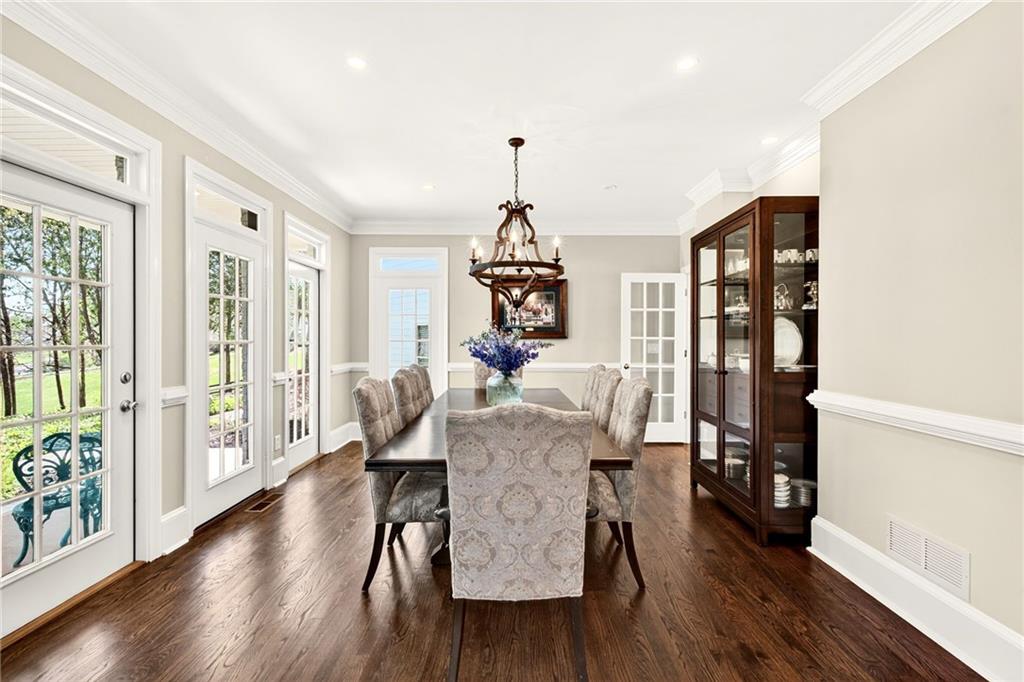 565 Old Lathemtown Road Canton, GA 30115 - Photo 14 of 73 a dining room with furniture a chandelier and wooden floor