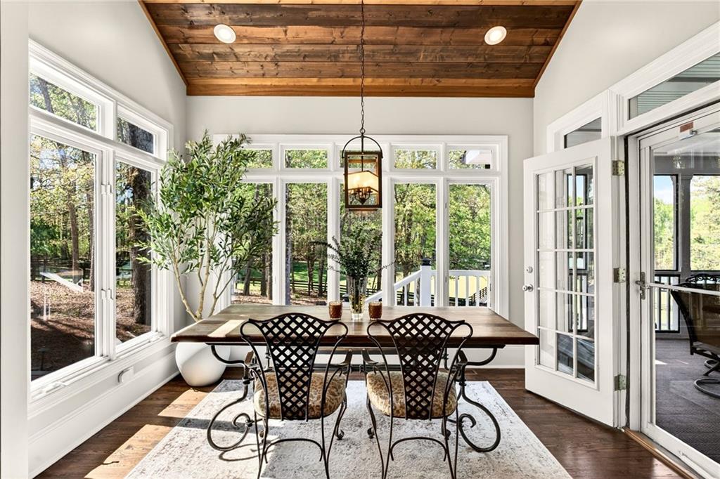 565 Old Lathemtown Road Canton, GA 30115 - Photo 30 of 73 a view of a dining room with furniture large windows and wooden floor