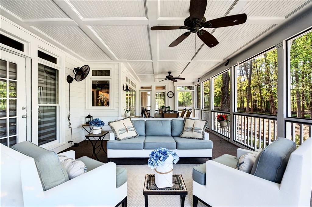 565 Old Lathemtown Road Canton, GA 30115 - Photo 32 of 73 a living room with furniture ceiling fan and a large window