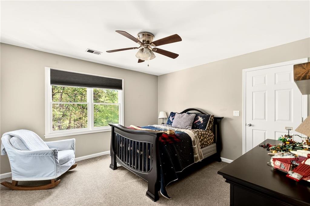 565 Old Lathemtown Road Canton, GA 30115 - Photo 39 of 73 a bedroom with a bed and a window
