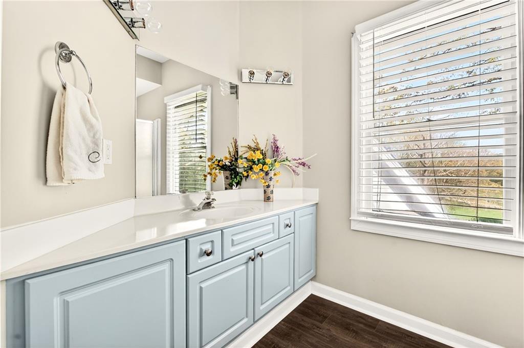 565 Old Lathemtown Road Canton, GA 30115 - Photo 41 of 73 a bathroom with a sink and a mirror