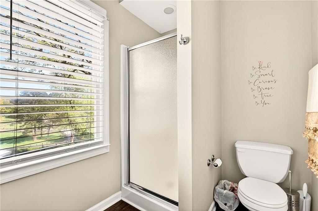 565 Old Lathemtown Road Canton, GA 30115 - Photo 42 of 73 a white toilet sitting next to a window