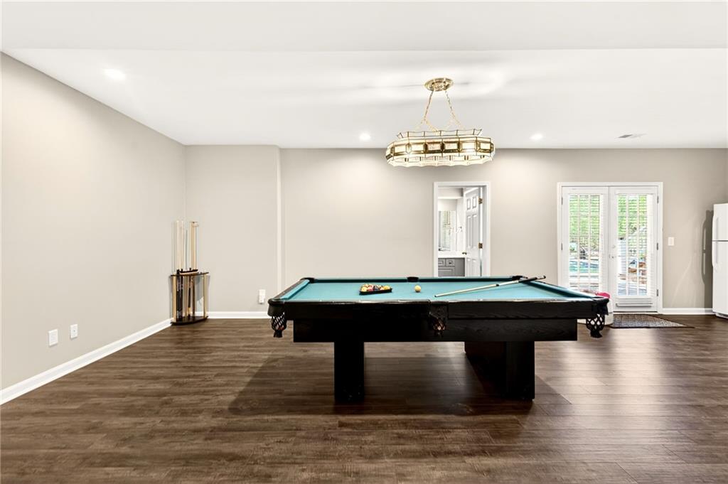 565 Old Lathemtown Road Canton, GA 30115 - Photo 44 of 73 a room with a table chairs and wooden floor