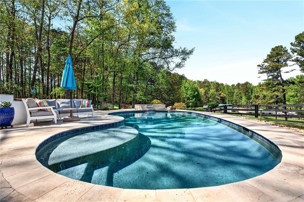565 Old Lathemtown Road Canton, GA 30115 - Photo 53 of 73 a view of a swimming pool with a sitting space