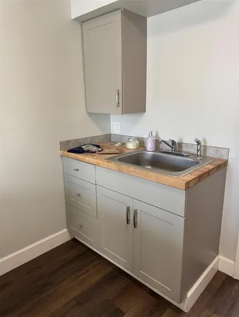 a white toilet sitting next to a bathroom sink
