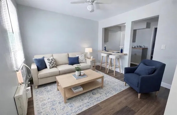 a living room with furniture and a rug