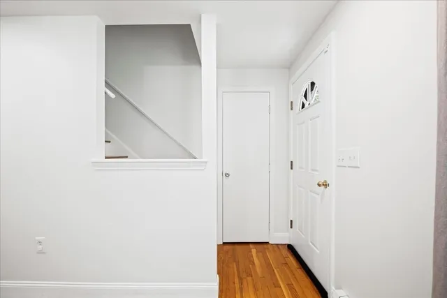 a view of room with wooden floor