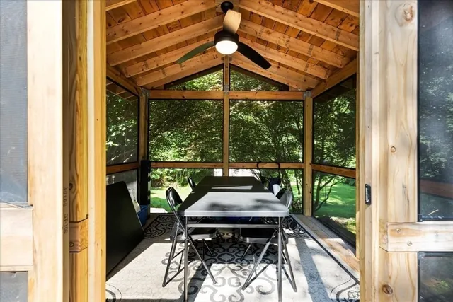 a view of a patio with a table chairs and a table