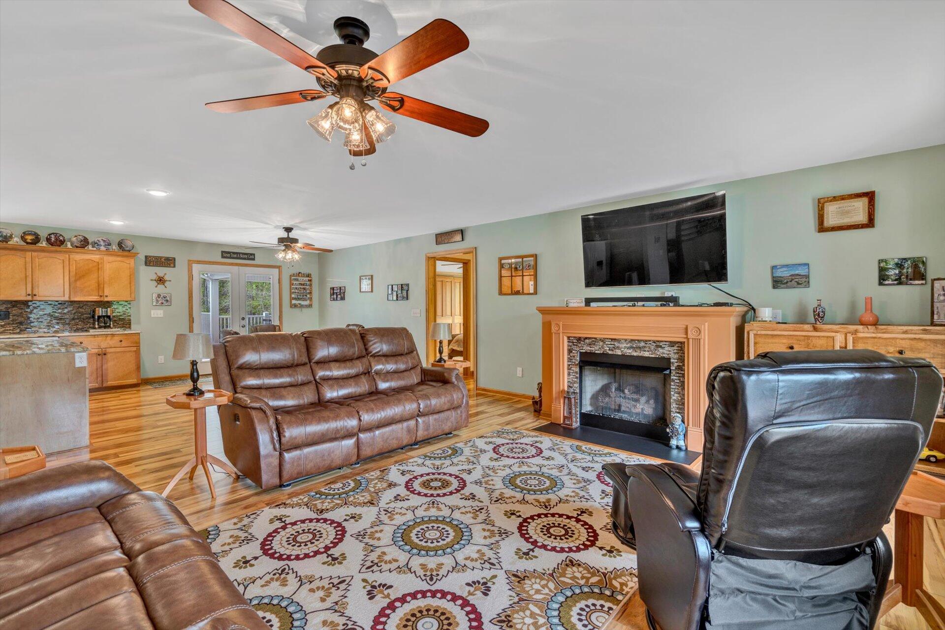 6 Highland Lake Road Union Hall, VA 24176 - Photo 10 of 56 a living room with furniture a fireplace and a flat screen tv