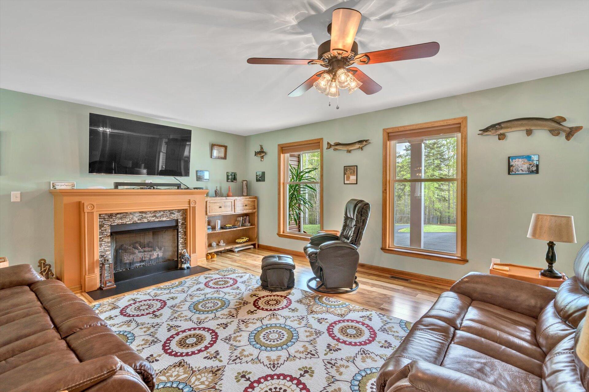 6 Highland Lake Road Union Hall, VA 24176 - Photo 11 of 56 a living room with furniture a flat screen tv and a fireplace