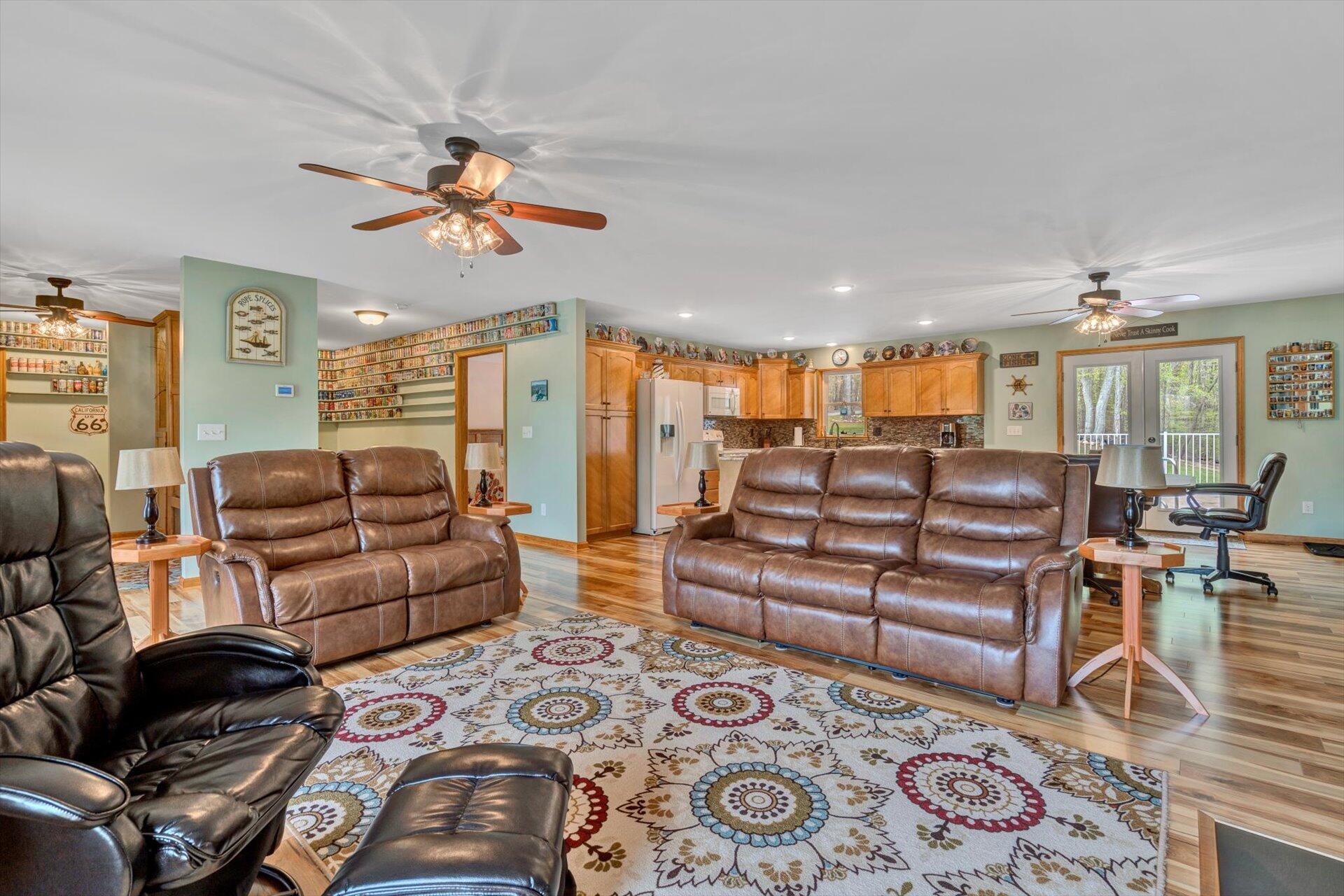 6 Highland Lake Road Union Hall, VA 24176 - Photo 12 of 56 a living room with furniture and a chandelier
