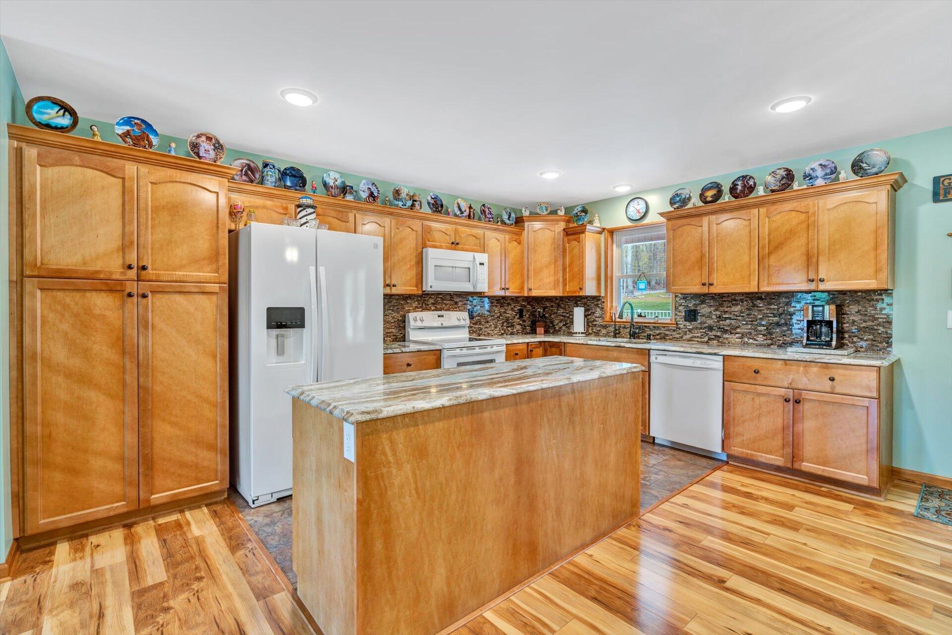 6 Highland Lake Road Union Hall, VA 24176 - Photo 14 of 56 a kitchen with stainless steel appliances a refrigerator and a stove top oven