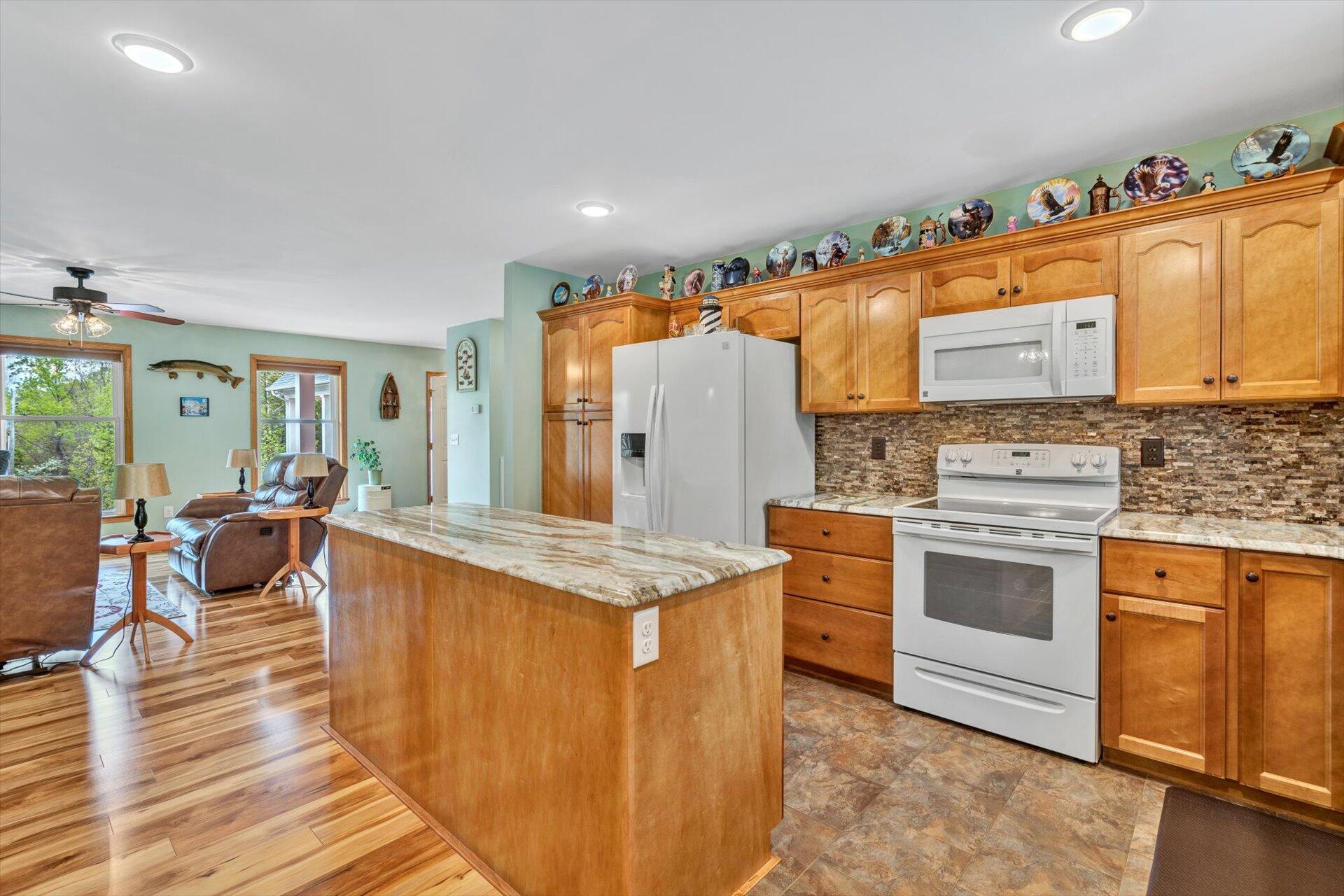 6 Highland Lake Road Union Hall, VA 24176 - Photo 15 of 56 a kitchen with stainless steel appliances granite countertop a stove oven and a refrigerator with cabinets