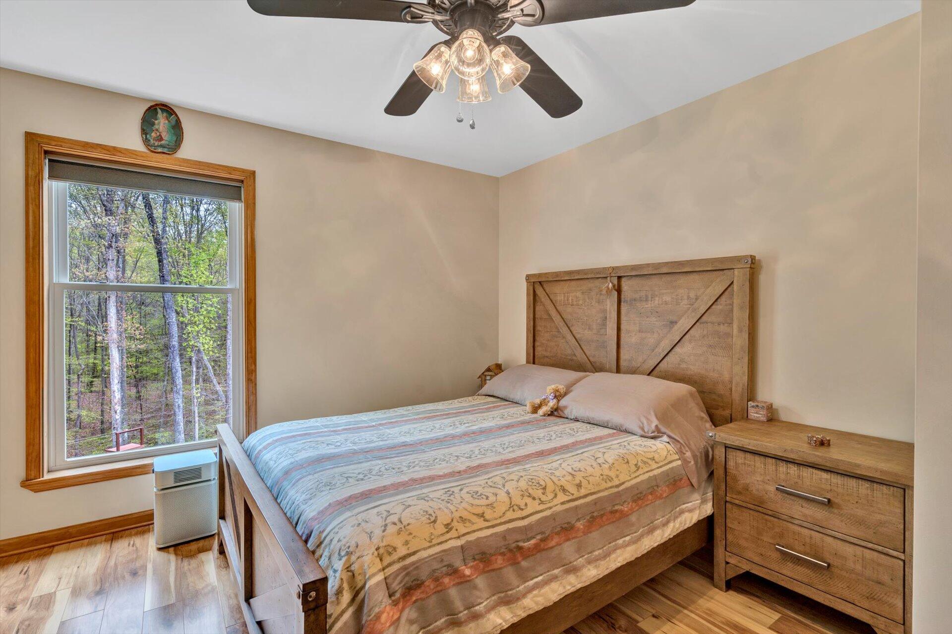 6 Highland Lake Road Union Hall, VA 24176 - Photo 19 of 56 a bedroom with a bed and a window