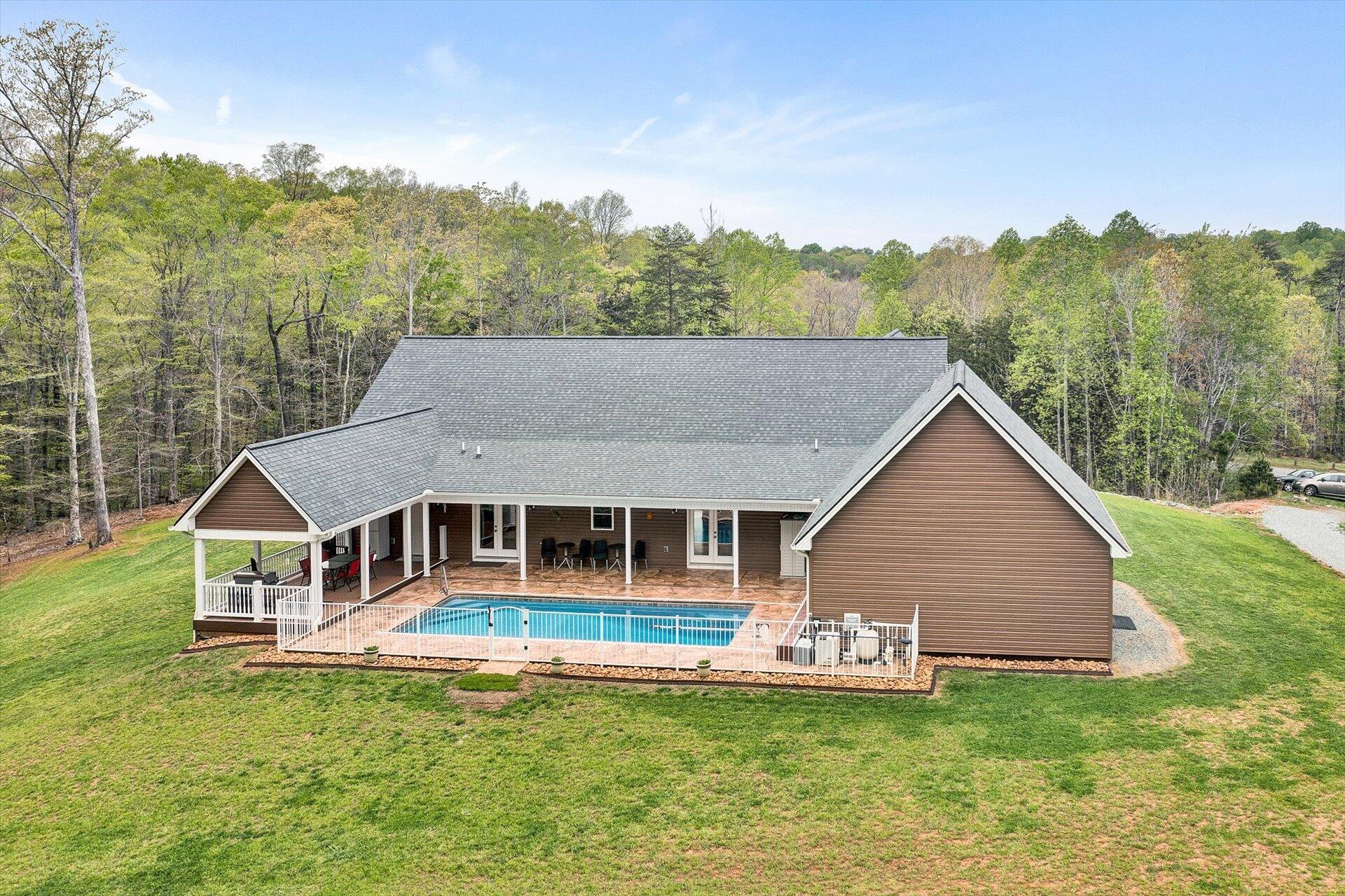 6 Highland Lake Road Union Hall, VA 24176 - Photo 2 of 56 a aerial view of a house with a garden and lake view