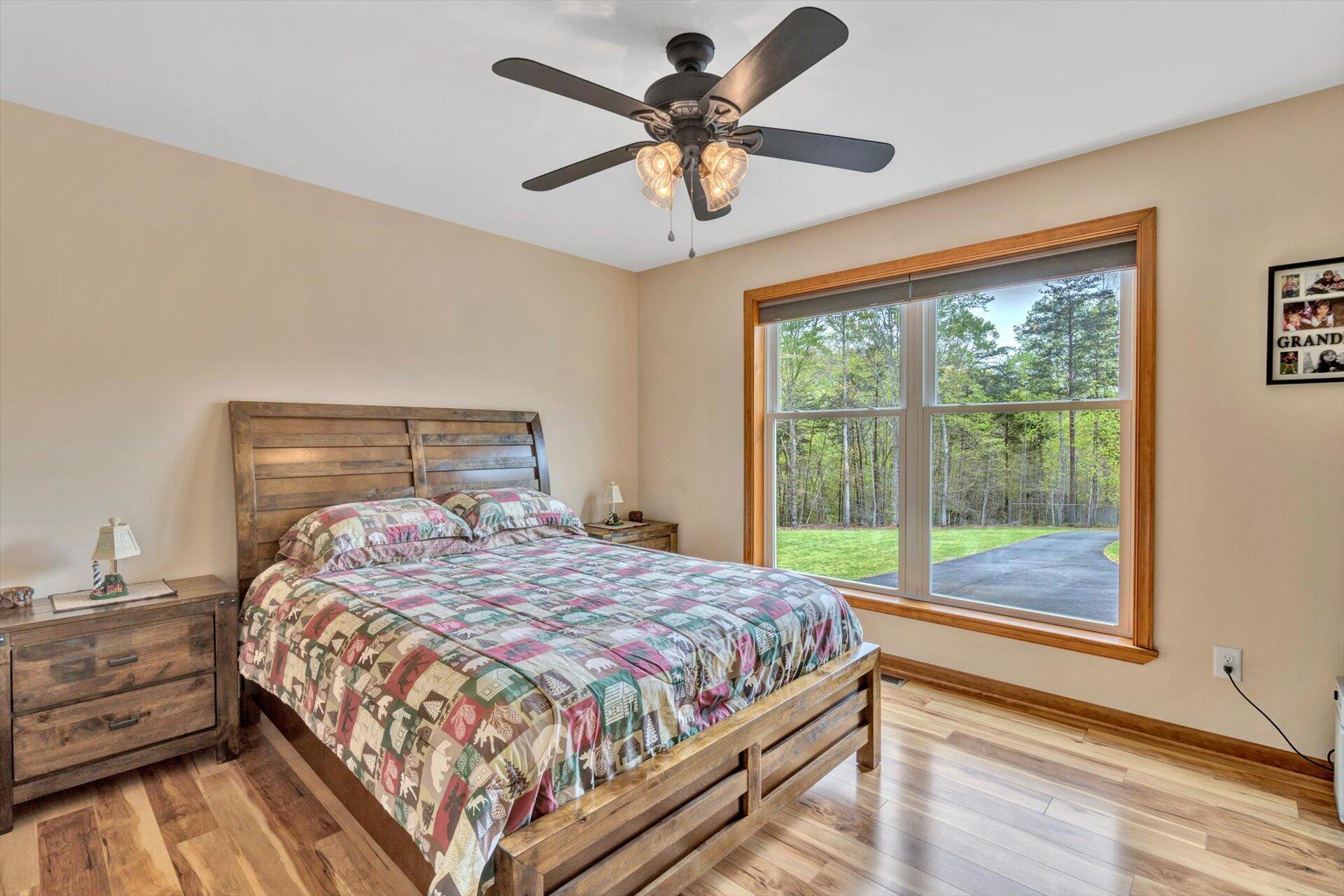 6 Highland Lake Road Union Hall, VA 24176 - Photo 22 of 56 a bedroom with a bed and a large window
