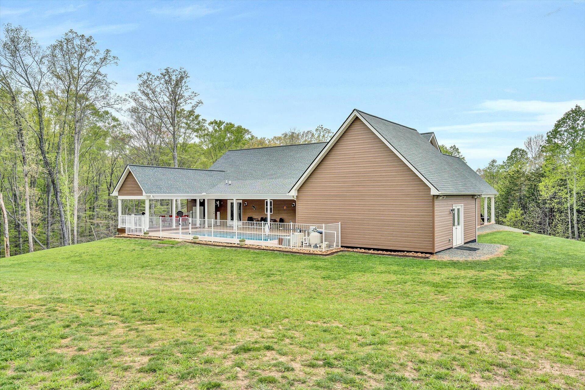 6 Highland Lake Road Union Hall, VA 24176 - Photo 41 of 56 a view of a house with a yard and sitting area