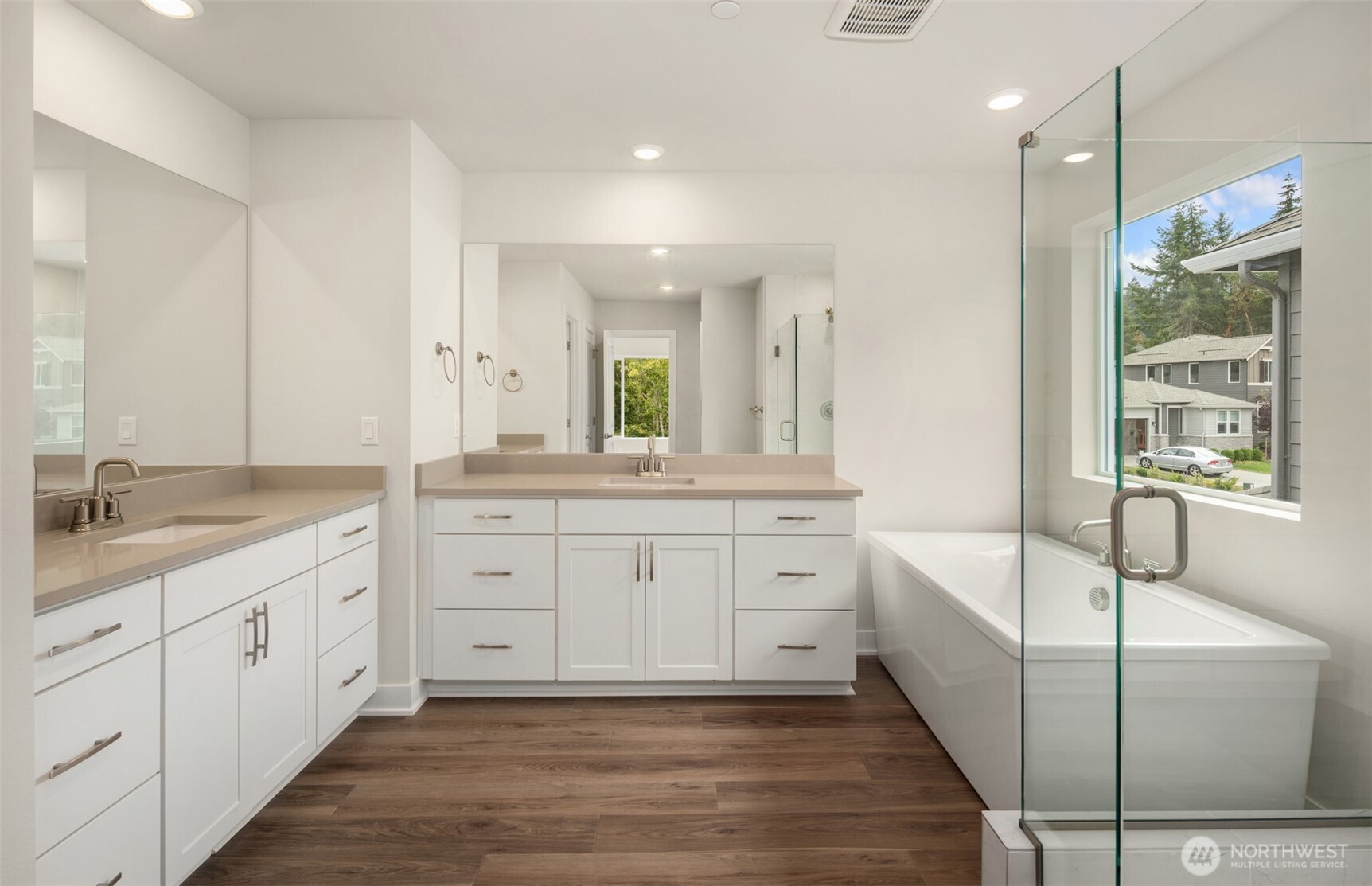 23277 Arbors Ter Road Northeast, Unit 16 Kingston, WA 98346 - Photo 11 of 20 a spacious bathroom with sinks mirror and a bathtub