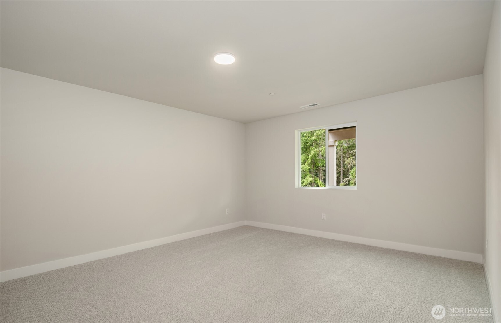 23277 Arbors Ter Road Northeast, Unit 16 Kingston, WA 98346 - Photo 15 of 20 an empty room with a window