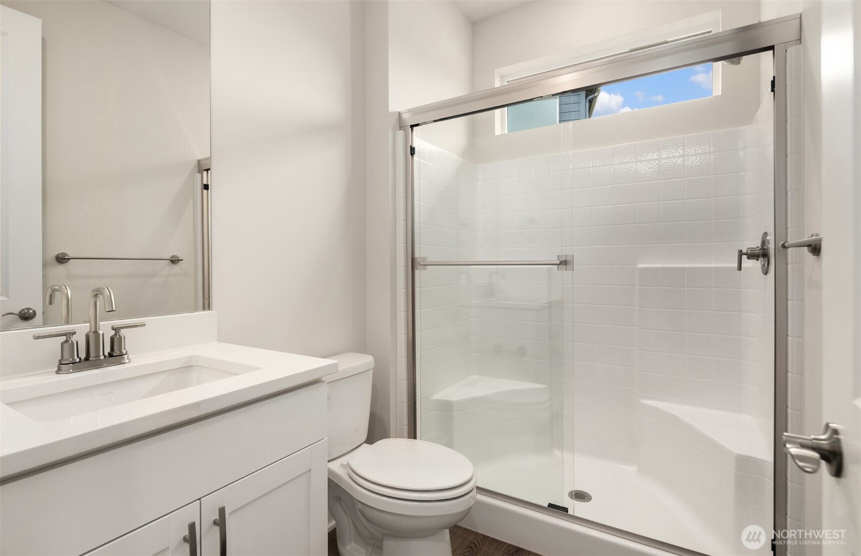 23277 Arbors Ter Road Northeast, Unit 16 Kingston, WA 98346 - Photo 17 of 20 a bathroom with a sink toilet and shower