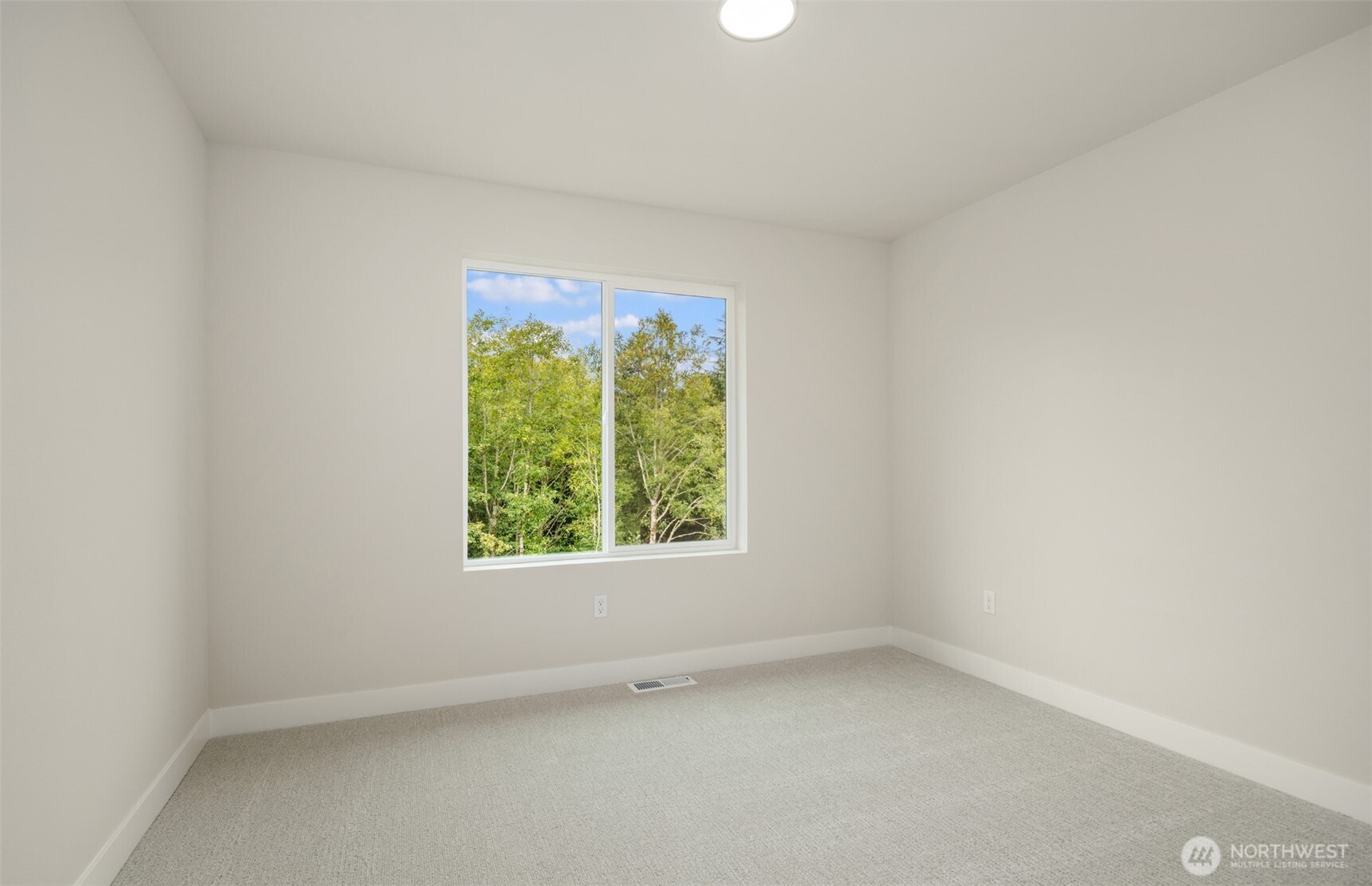 23277 Arbors Ter Road Northeast, Unit 16 Kingston, WA 98346 - Photo 19 of 20 an empty room with a window