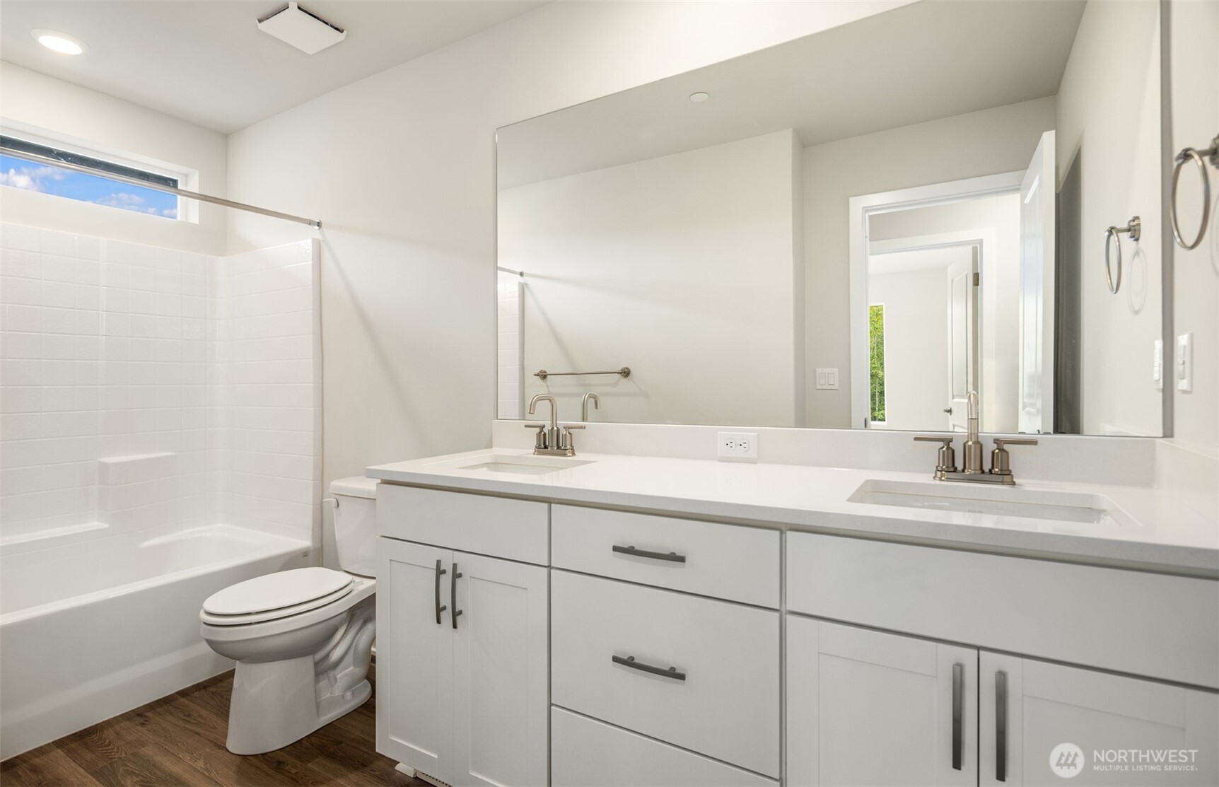 23277 Arbors Ter Road Northeast, Unit 16 Kingston, WA 98346 - Photo 20 of 20 a bathroom with a toilet sink and mirror