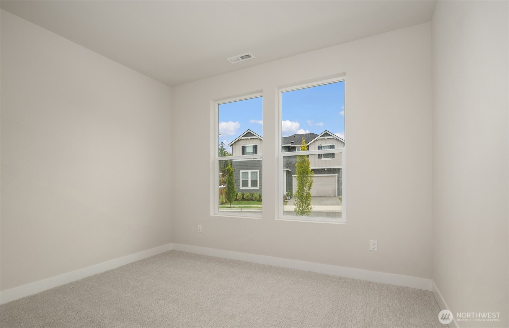 23277 Arbors Ter Road Northeast, Unit 16 Kingston, WA 98346 - Photo 9 of 20 an empty room with windows