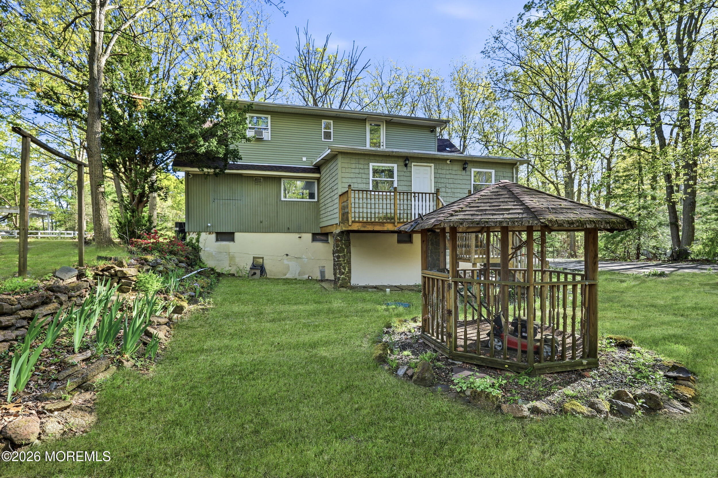 492 Cobain Road Jackson, NJ 08527 - Photo 40 of 47 a front view of a house with garden