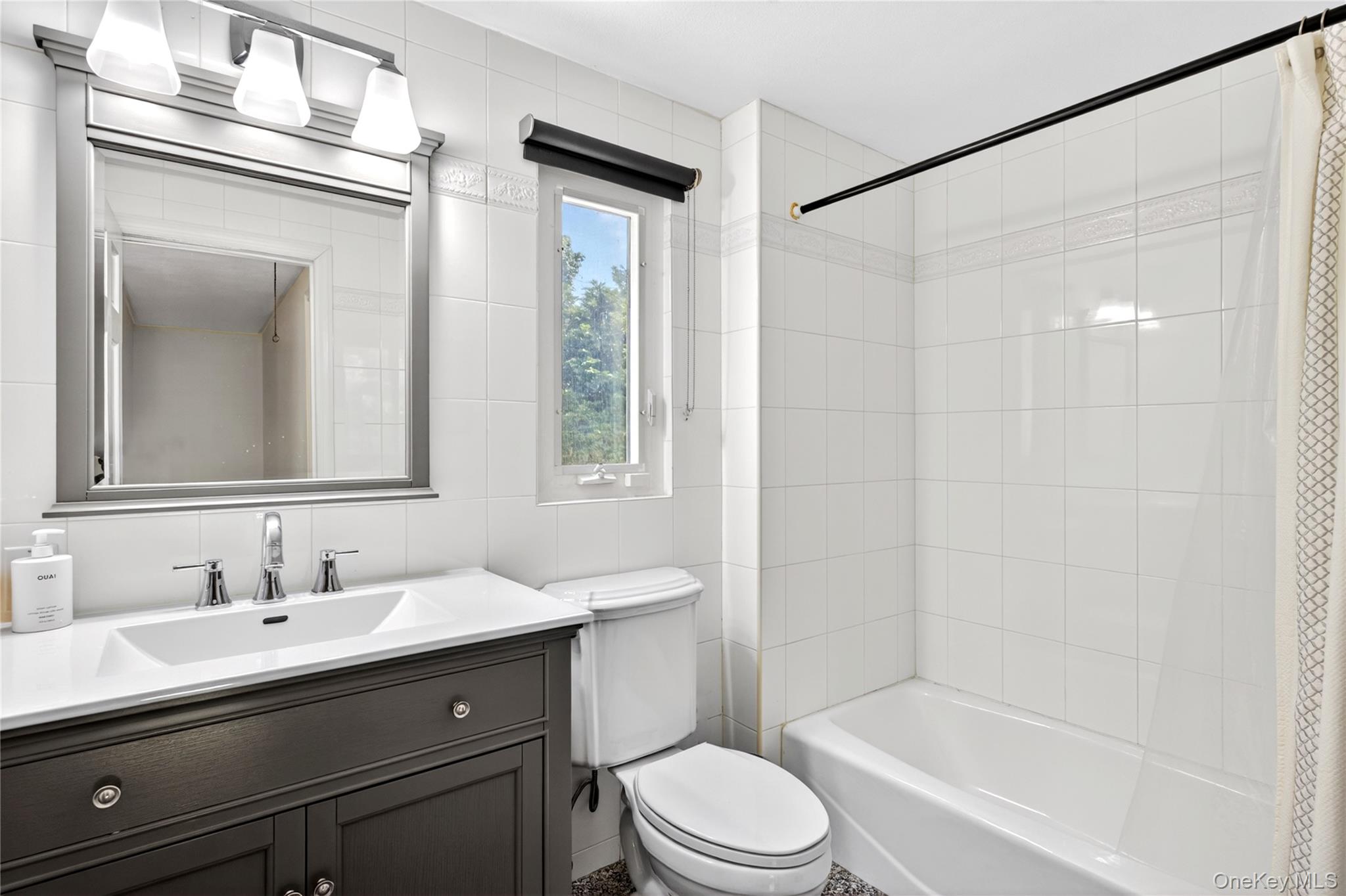 60 Mill Spring Road Manhasset, NY 11030 - Photo 15 of 18 a bathroom with a sink a toilet and shower