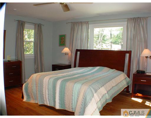 39 Clive Hills Road Edison, NJ 08820 - Photo 6 of 10 a bedroom with a bed and window