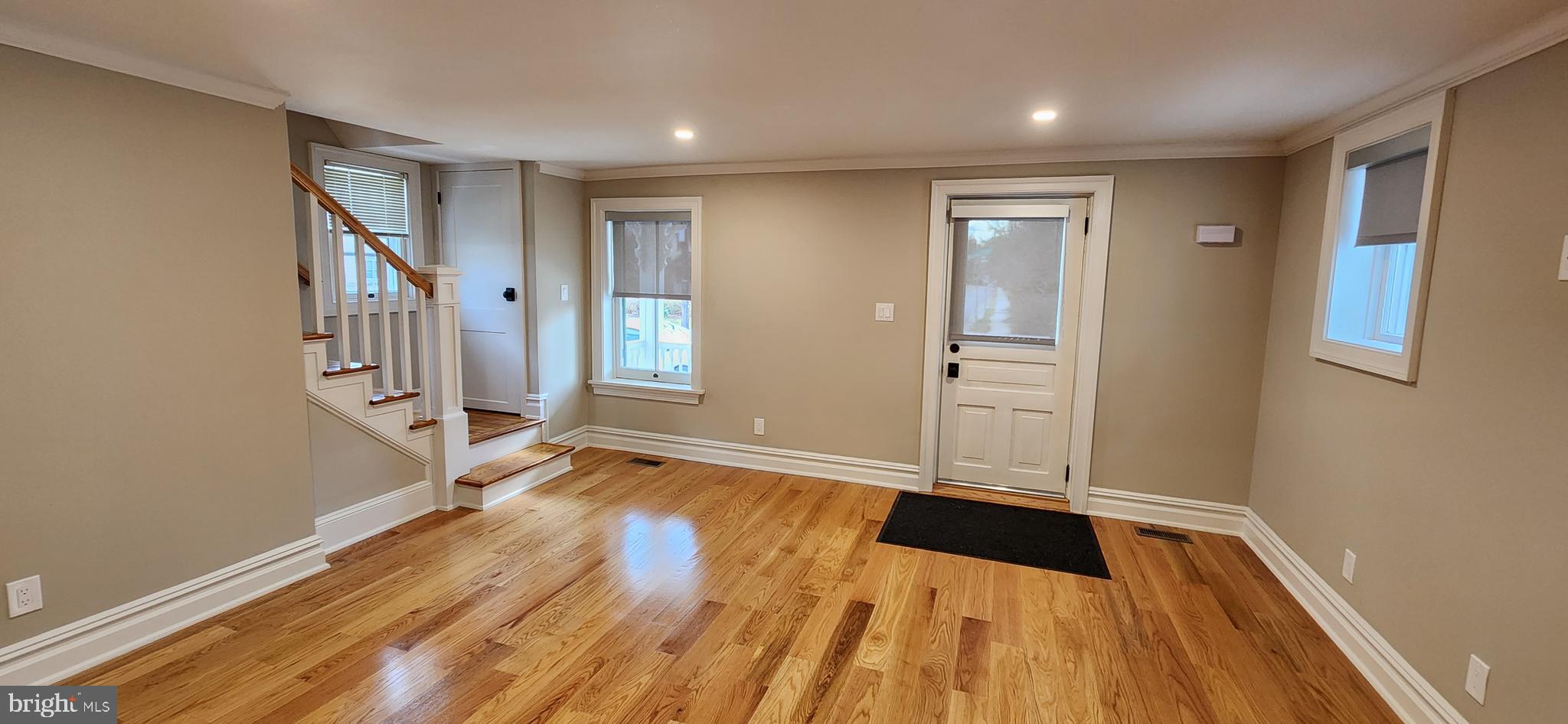 173 Washington Street Doylestown, PA 18901 - Photo 6 of 17 a view of an empty room with window and wooden floor