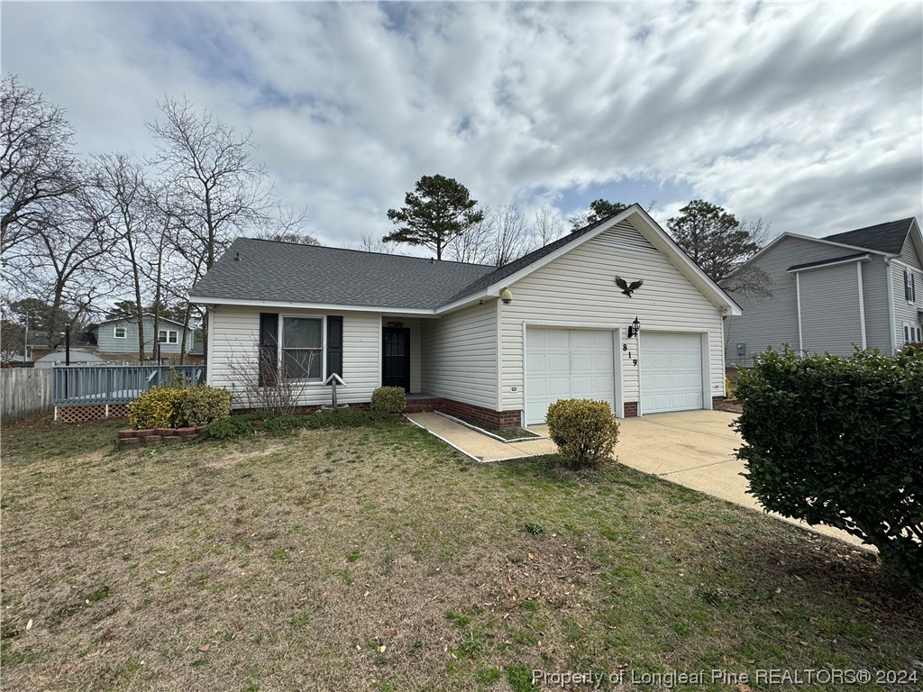 819 Rim Road Fayetteville, NC 28314 - Photo 2 of 42 a view of a house with backyard and garden