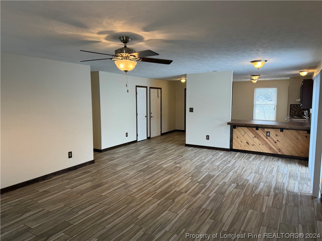 819 Rim Road Fayetteville, NC 28314 - Photo 23 of 42 a view of a livingroom with wooden floor