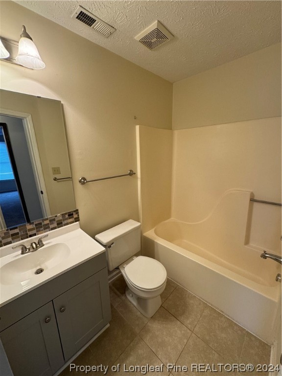 819 Rim Road Fayetteville, NC 28314 - Photo 30 of 42 a bathroom with a sink a toilet and a bathtub