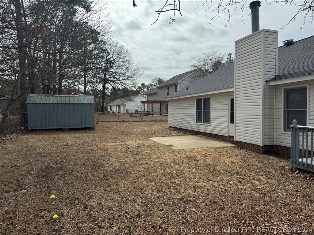 819 Rim Road Fayetteville, NC 28314 - Photo 10 of 42 a view of a house with a yard