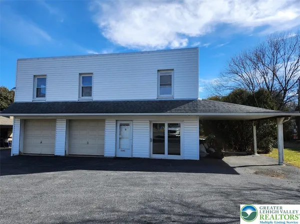 a front view of house with yard