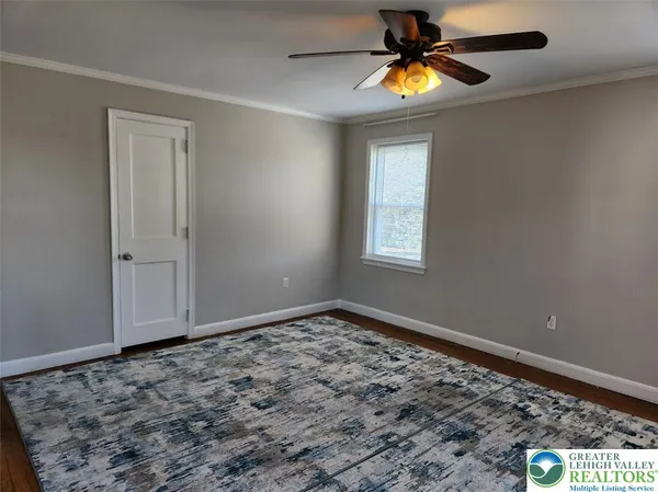 a view of an empty room and window