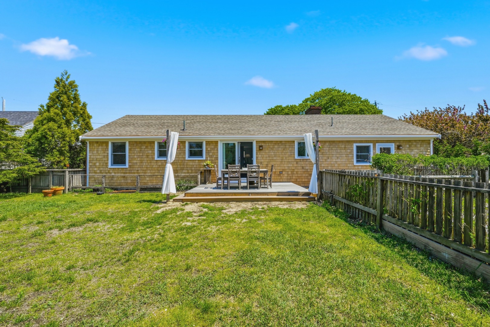 3 Newtown Road Nantucket, MA 02554 - Photo 18 of 20 a front view of a house with a yard