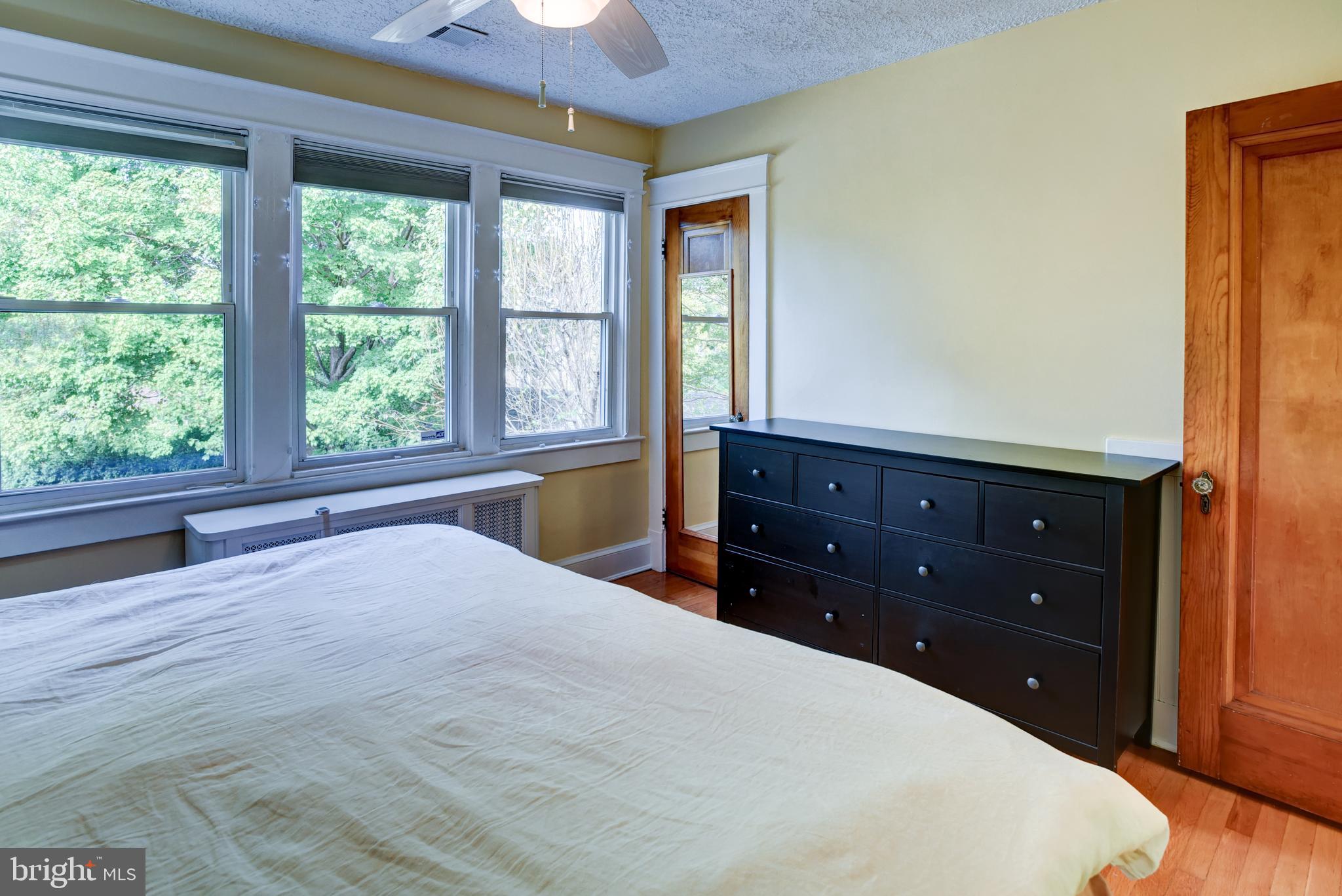 7216 7th Street Northwest Washington, DC 20012 - Photo 14 of 26 a bedroom with a bed and a dresser