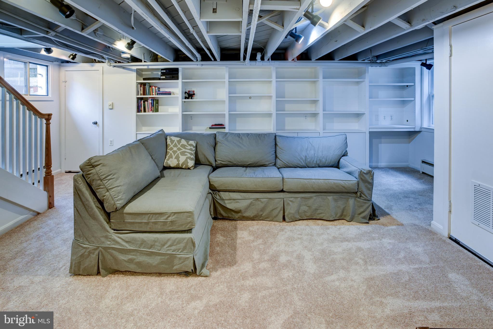 7216 7th Street Northwest Washington, DC 20012 - Photo 19 of 26 a living room with furniture and a glass door