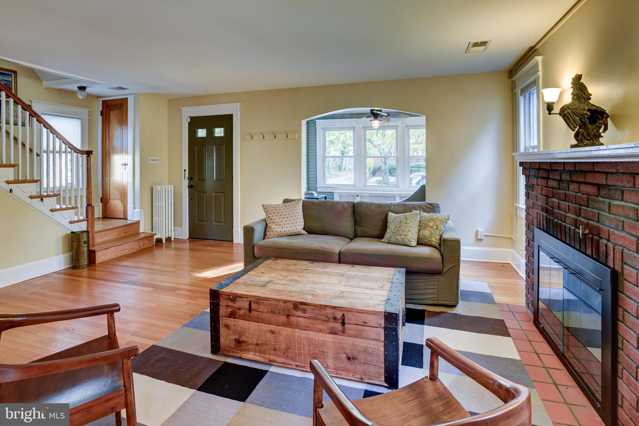 7216 7th Street Northwest Washington, DC 20012 - Photo 3 of 26 a living room with furniture and a fireplace