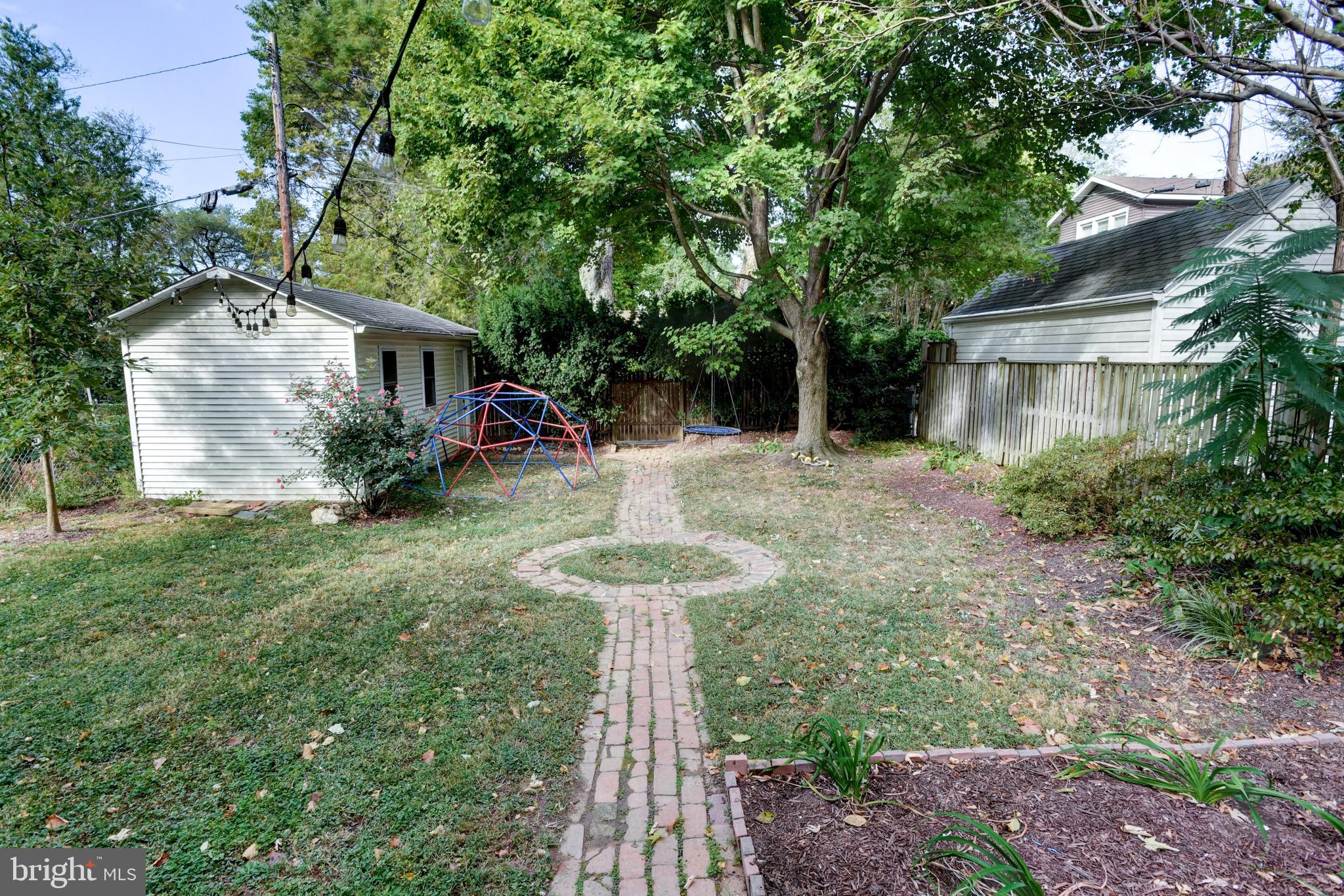 7216 7th Street Northwest Washington, DC 20012 - Photo 23 of 26 a view of a house with backyard sitting area and garden