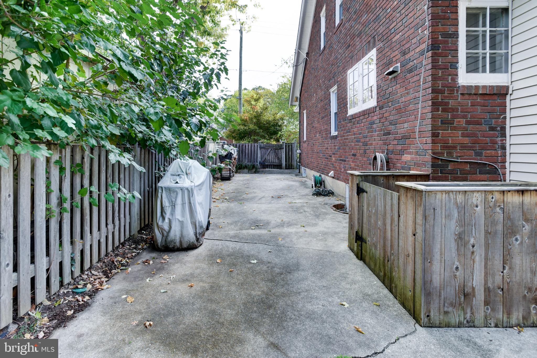 7216 7th Street Northwest Washington, DC 20012 - Photo 24 of 26 a view of a pathway of a building with wooden fence