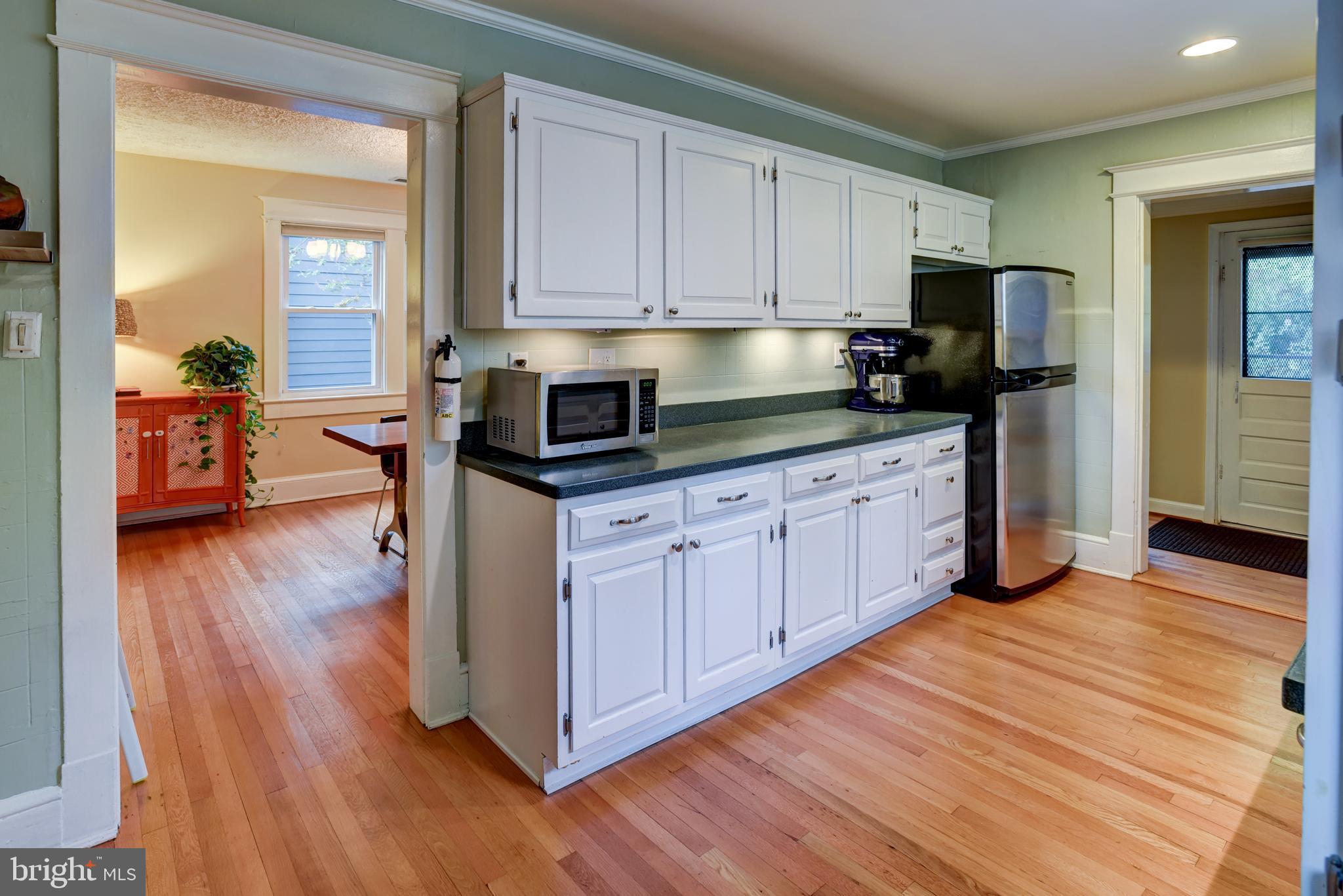 7216 7th Street Northwest Washington, DC 20012 - Photo 8 of 26 a kitchen with stainless steel appliances a stove top oven and a refrigerator