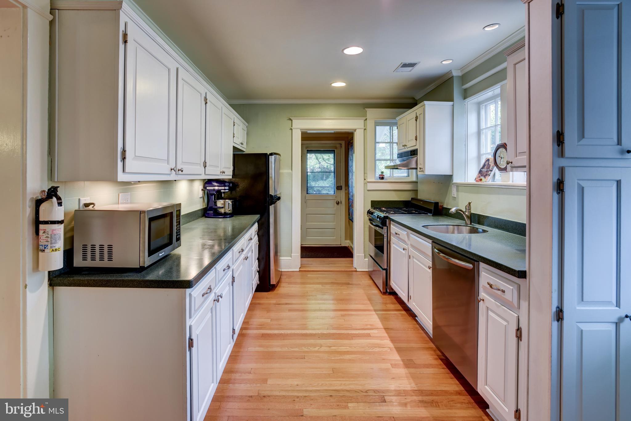 7216 7th Street Northwest Washington, DC 20012 - Photo 10 of 26 a kitchen with stainless steel appliances granite countertop lots of counter top space and cabinets