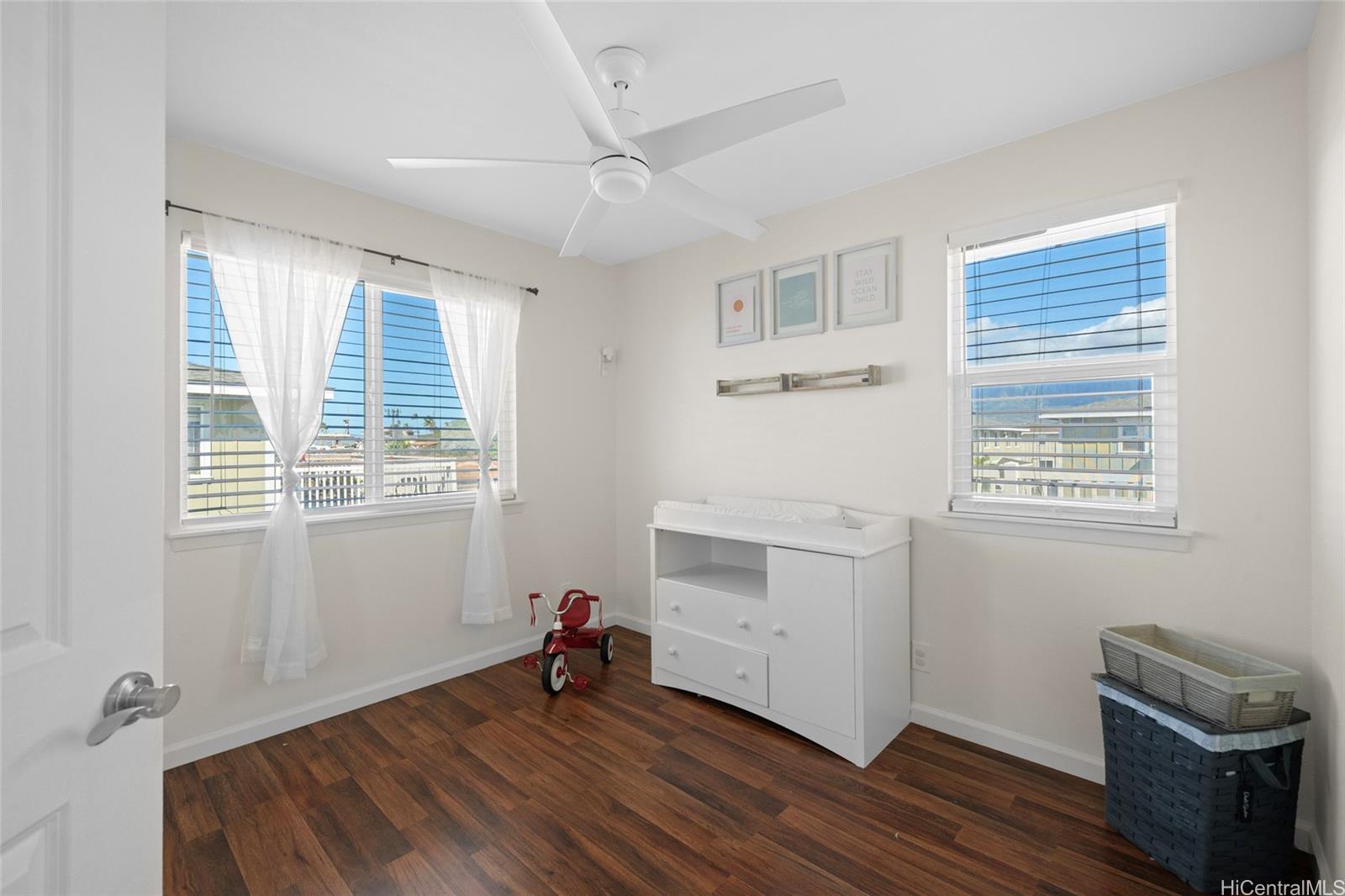 87-176 Maipalaoa Road, Unit D12 Waianae, HI 96792 - Photo 20 of 25 a view of a room with wooden floor and windows