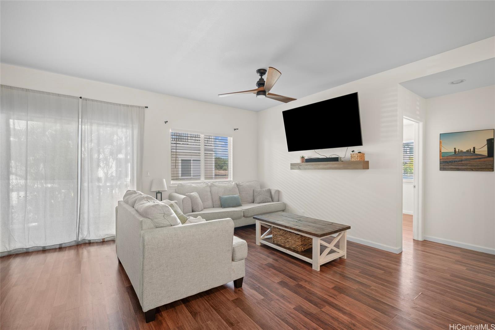 87-176 Maipalaoa Road, Unit D12 Waianae, HI 96792 - Photo 5 of 25 a living room with furniture and a flat screen tv