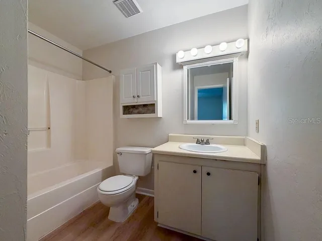 a bathroom with a toilet a sink and a bathtub