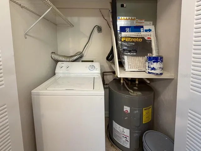 a utility room with dryer and washer